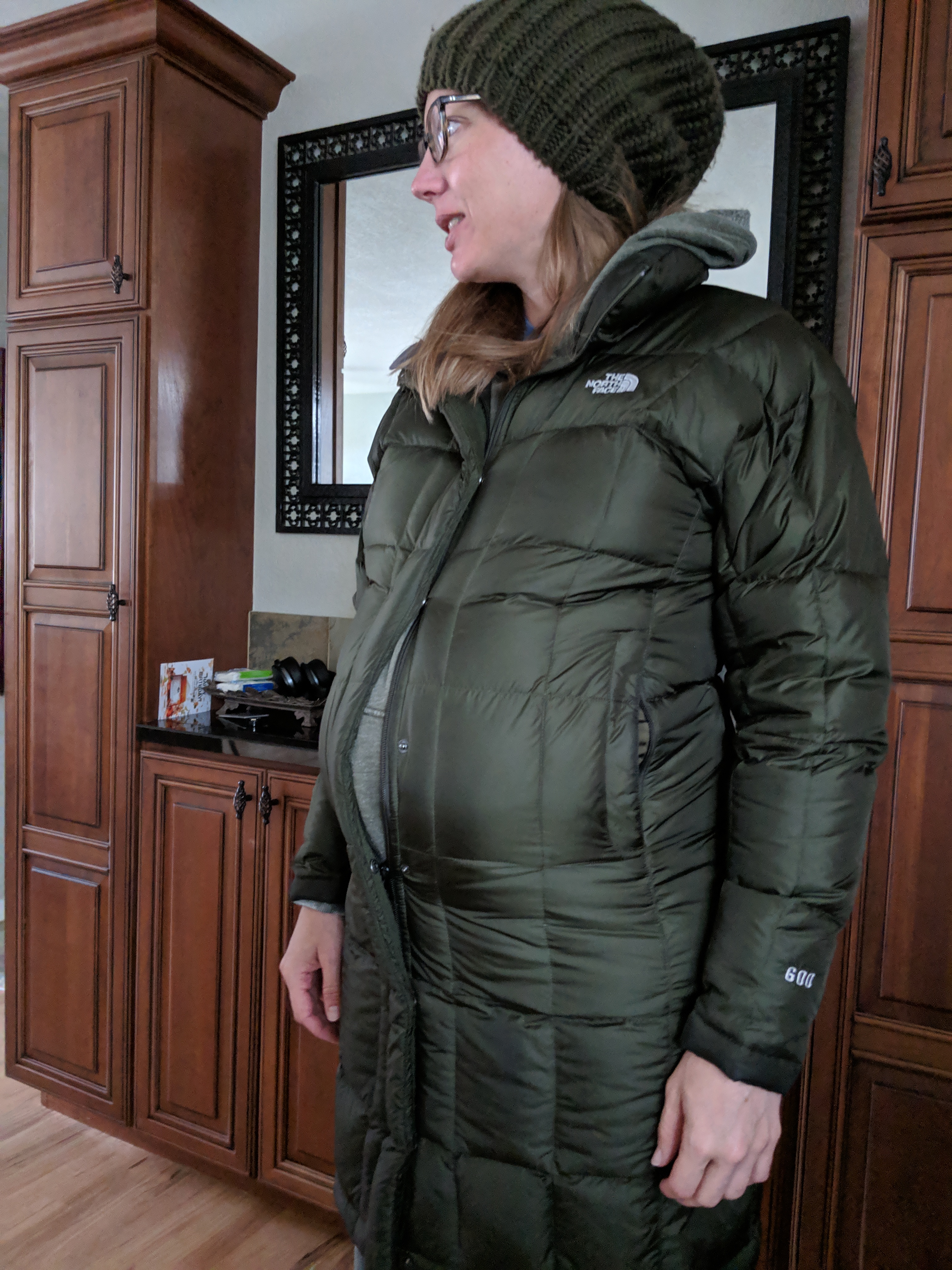 Katie bursting out of her coat before giving birth.