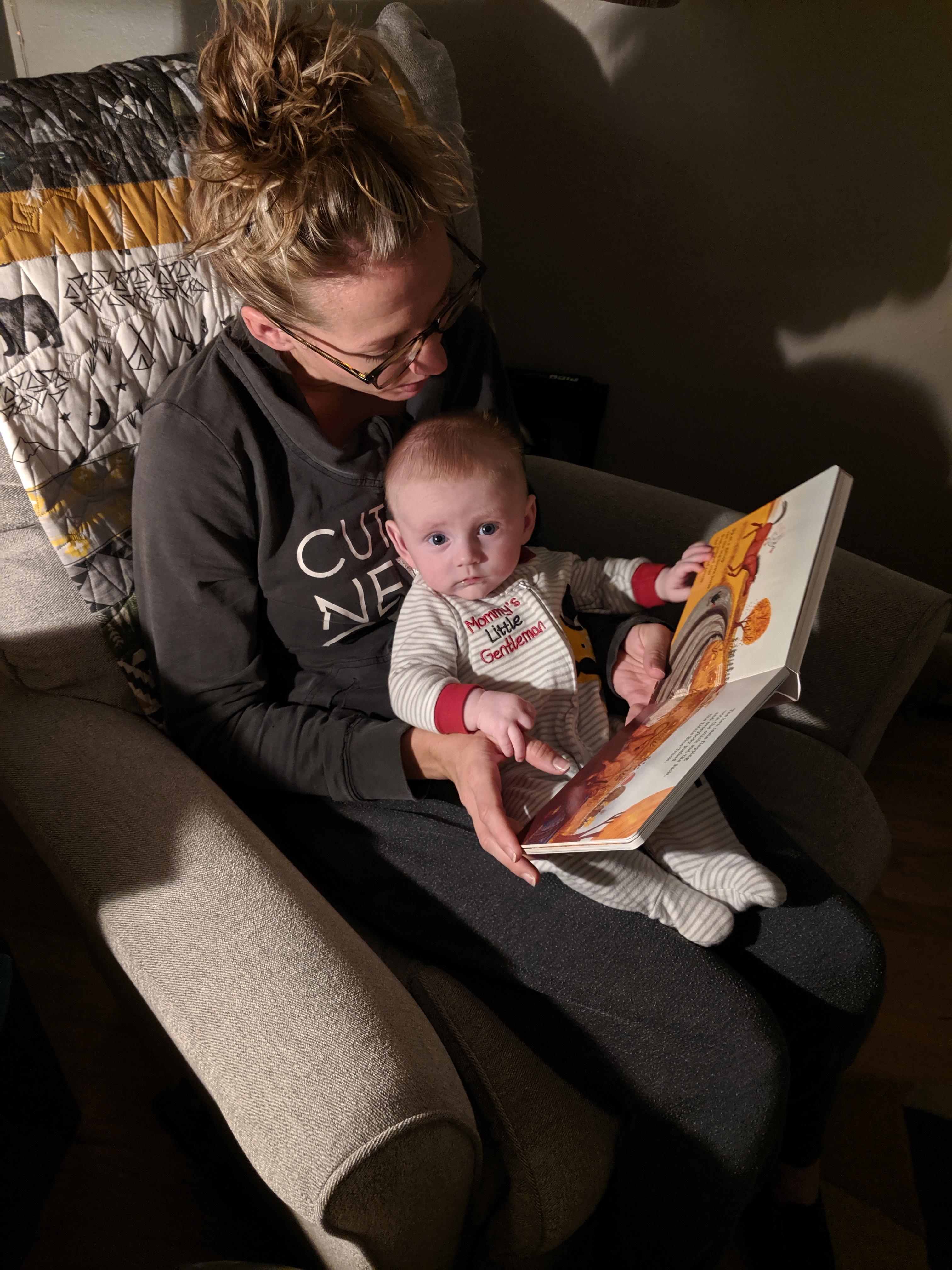 Katie reads to Owen.