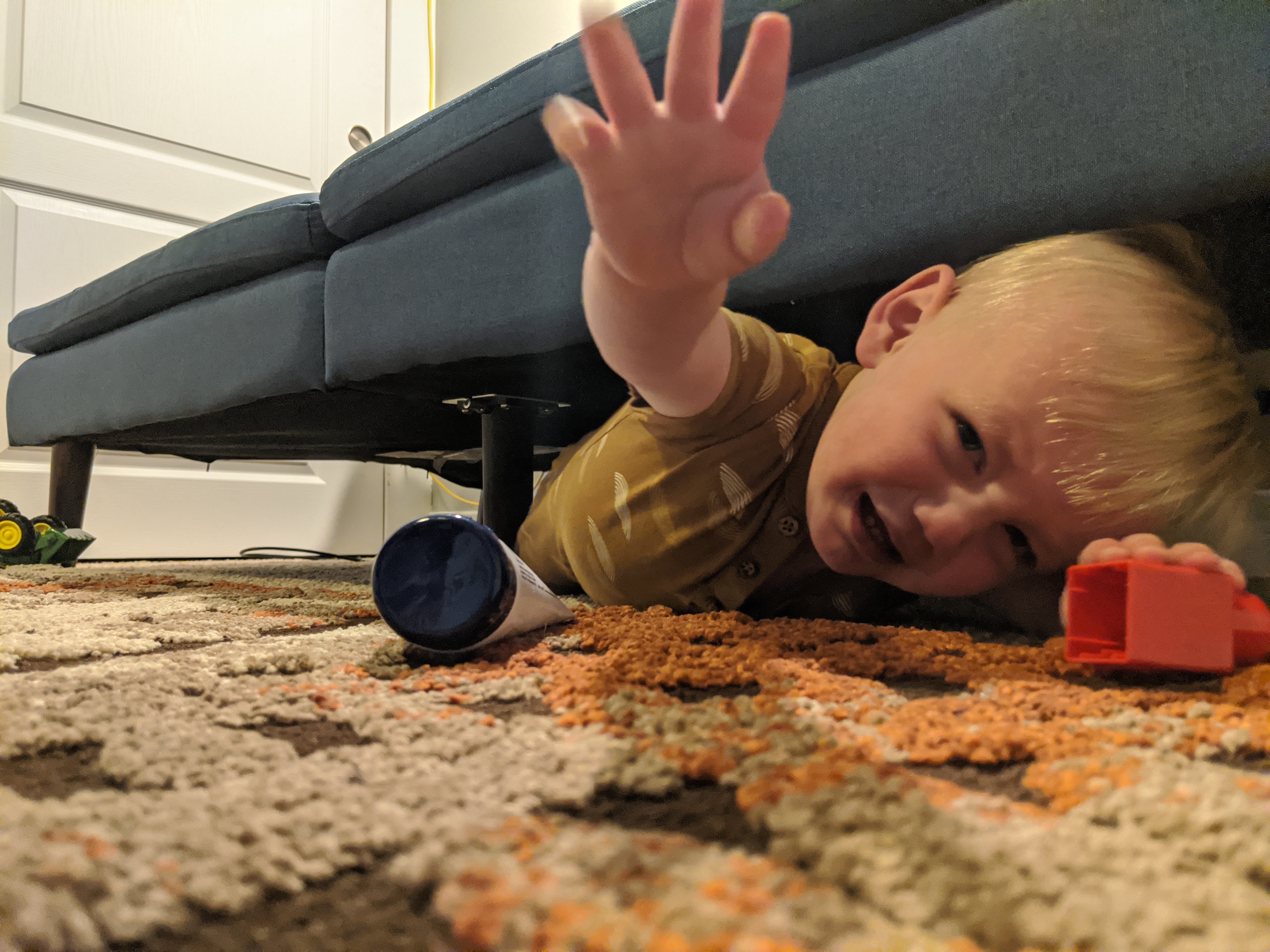 Owen goes on a reconnaissance mission under the couch.