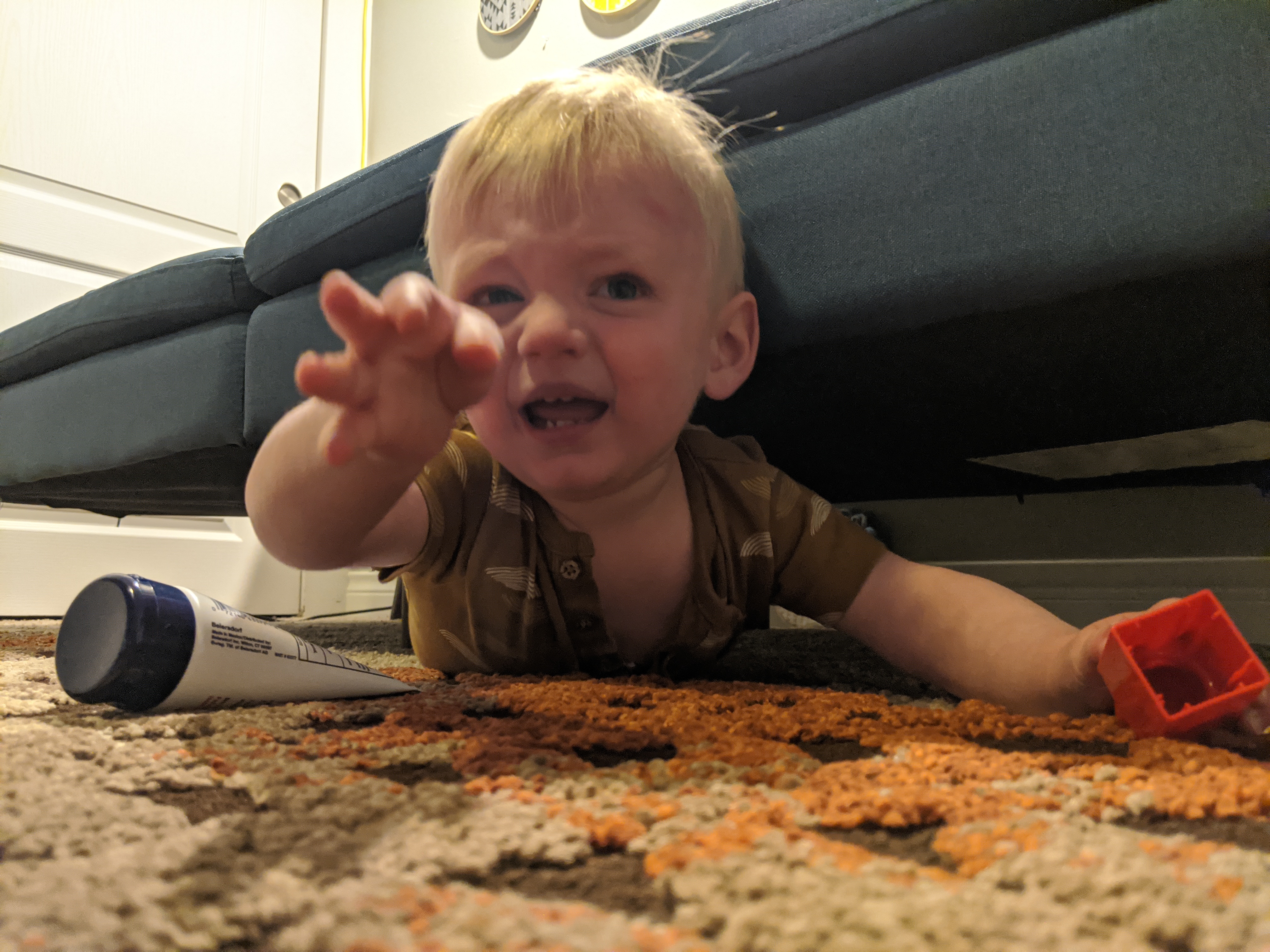 Owen goes on a reconnaissance mission under the couch.