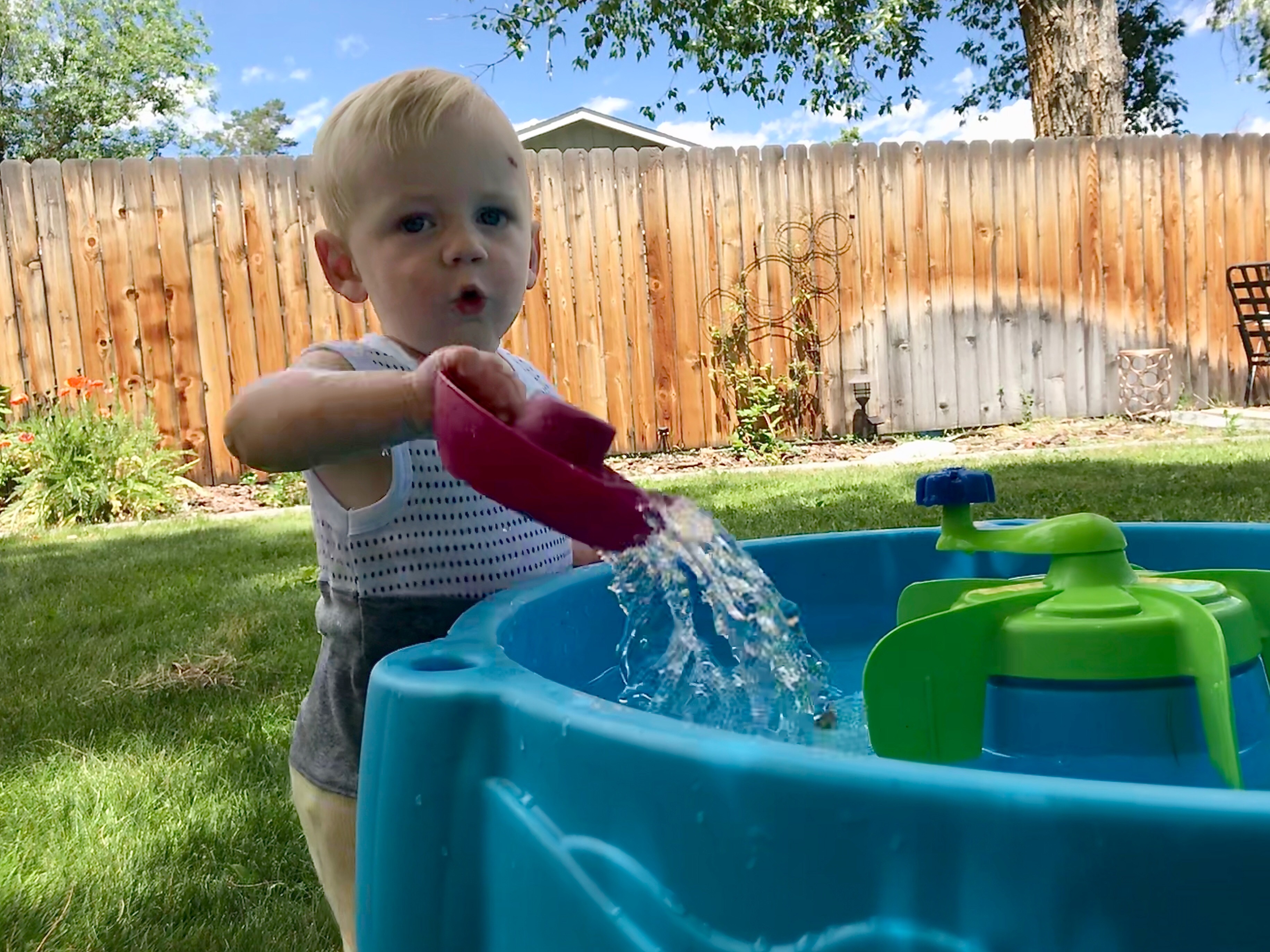 Owen playing with water at his water table.
